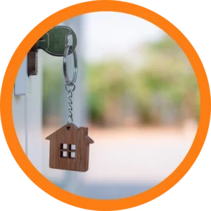 A key in a lock with a house keychain